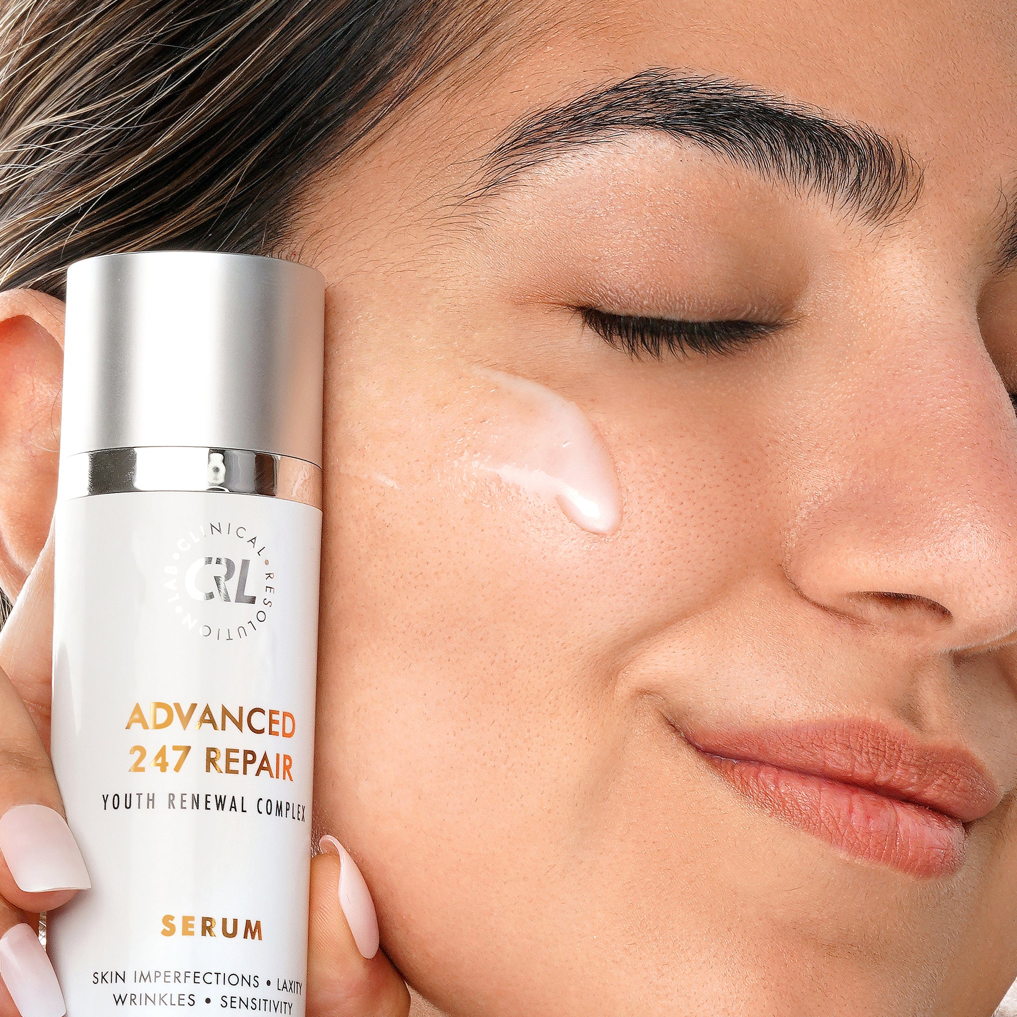 Clinical Resolution Advanced 247 Repair Serum with model and serum on face