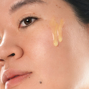 clinical resolution age defying liposomal retinol 1% pure retinol serum smear on face of woman