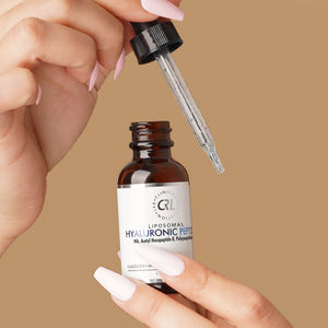 CRL Hyaluronic Peptide Serum in hand with beige background