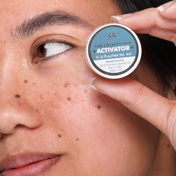 CRL pure collagen mask activator bottle in hand of model