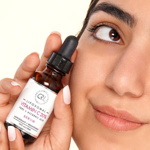 Clinical Resolution Lab Liposomal Vitamin C Serum 20% in hands of model