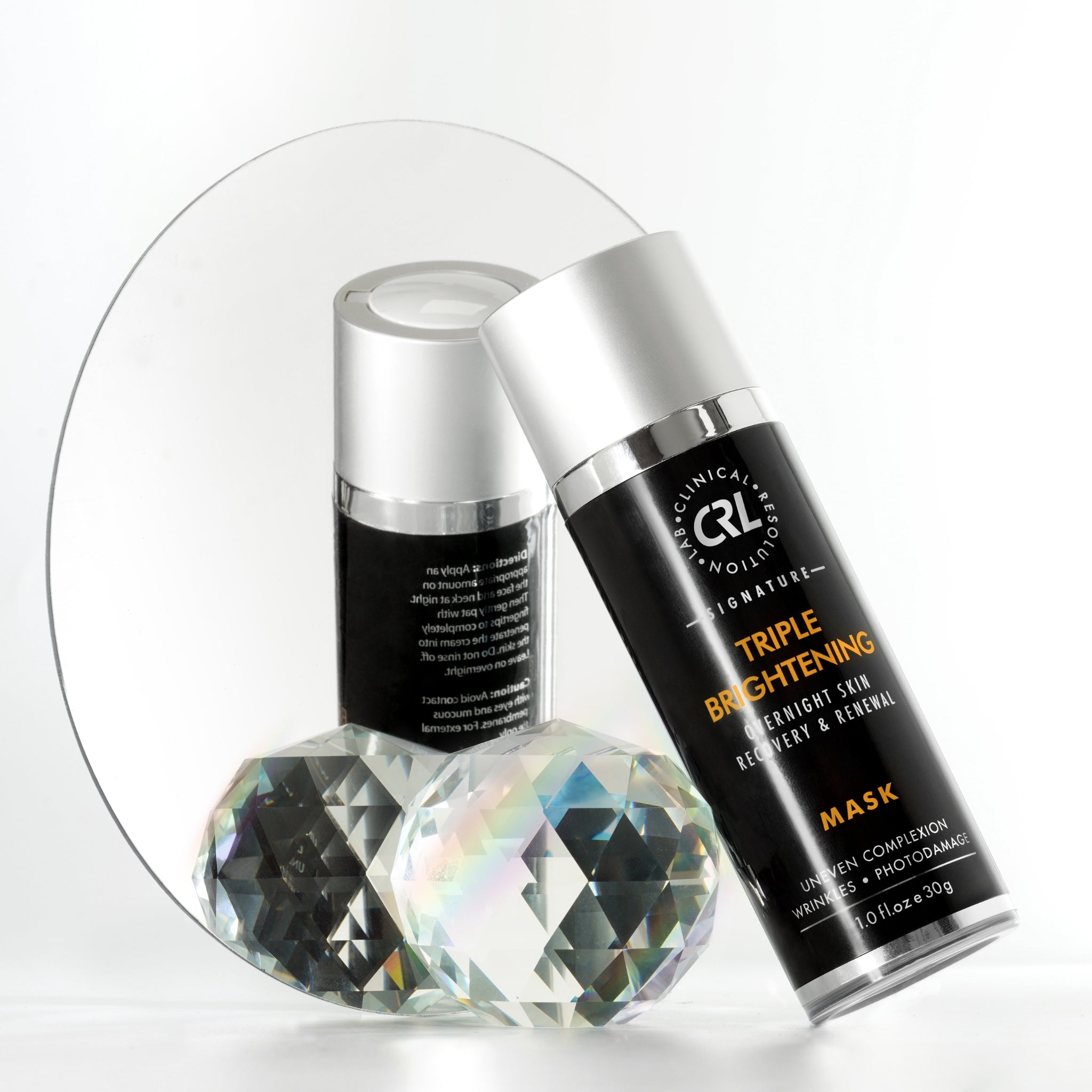 triple brightening mask bottle leaning on mirror