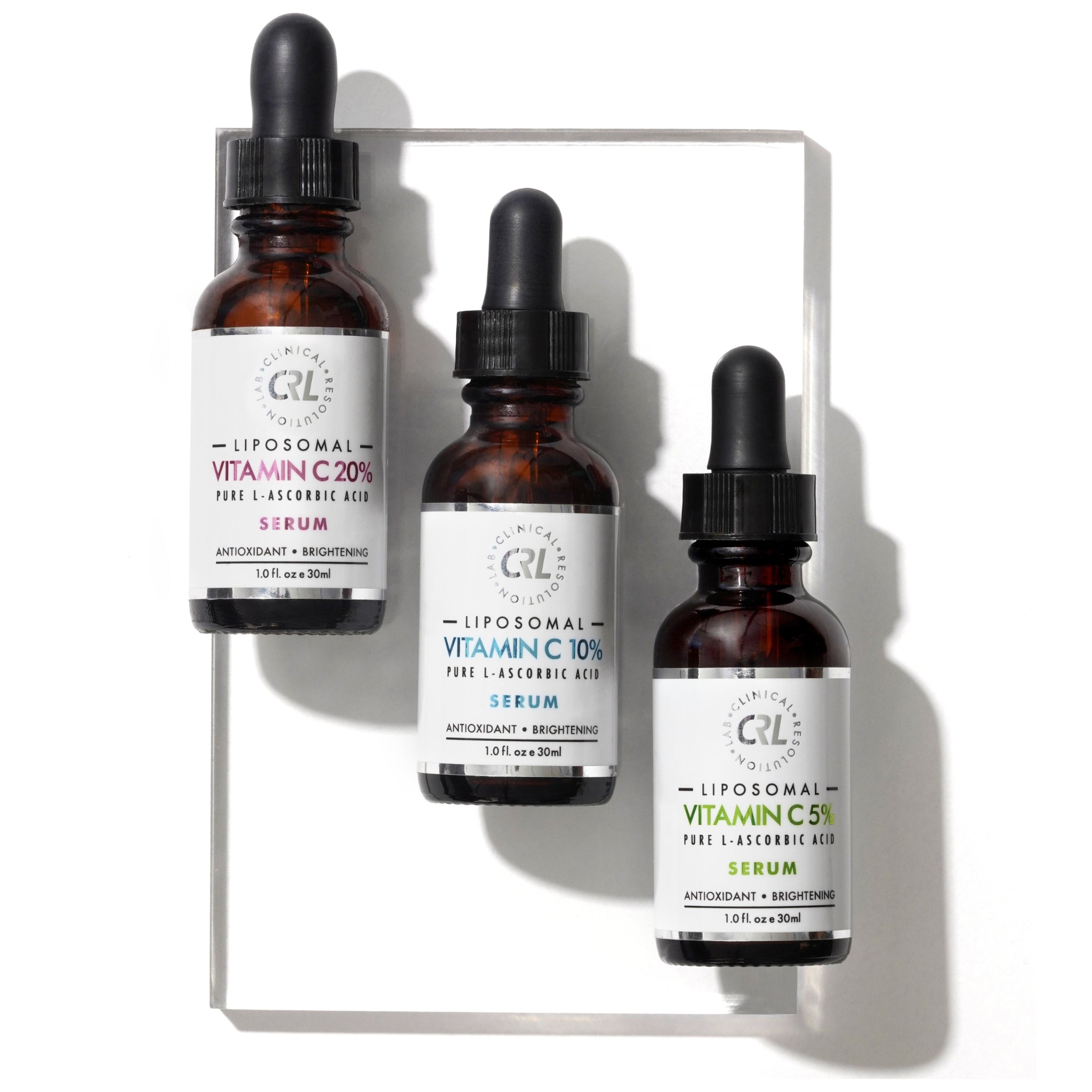 CRL vitamin c serums on glass on white background