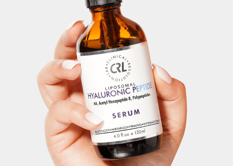 hyaluronic peptide serum in hand