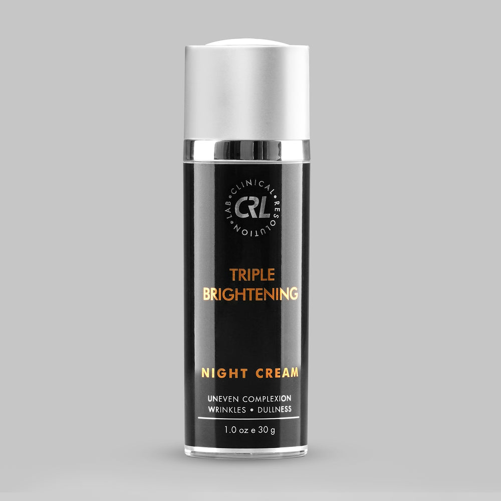 Triple Brightening Night Cream bottle with silver cap on a gray background