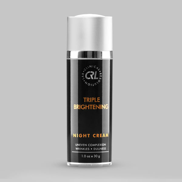 Triple Brightening Night Cream bottle with silver cap on a gray background
