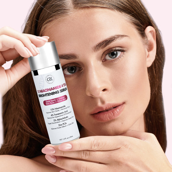 a model with a bottle of 15 Niacinamide 4 TXA Brightening Serum