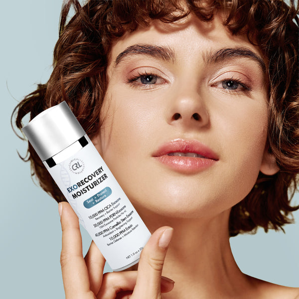 a model with a bottle of ExoRecovery Moisturizer