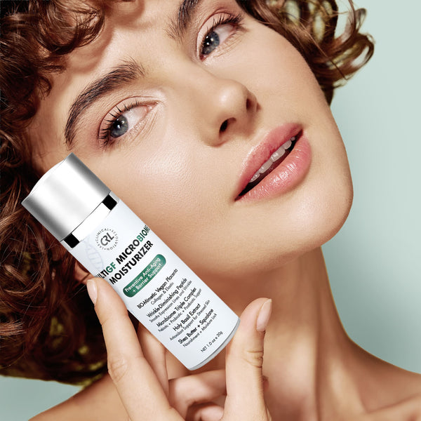 a model with a bottle of MultiGF MicroBiome Moisturizer