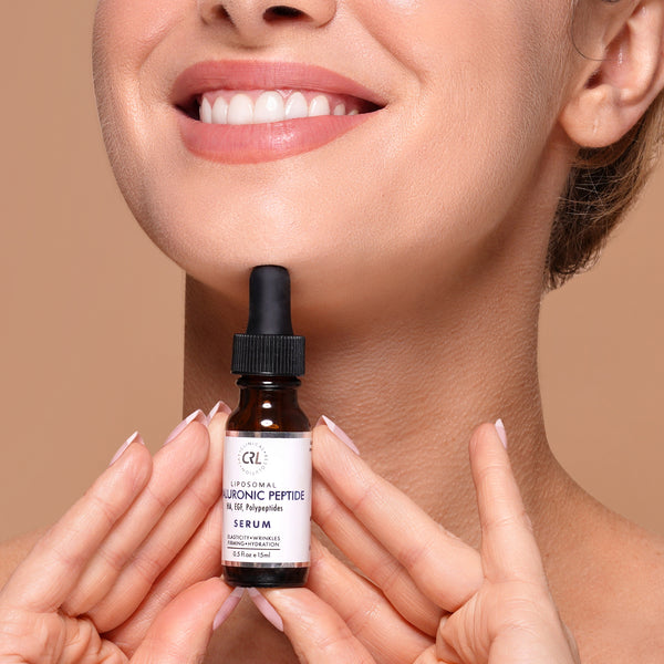 hyaluronic peptide serum in hands of model