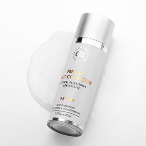 clinical resolution premier spot corrector serum smear and bottle on white background