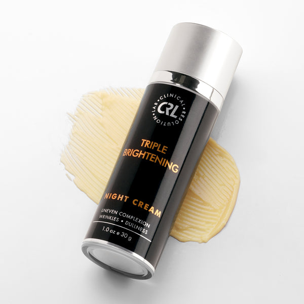 Skincare bottle labeled 'Triple Brightening Night Cream' with a swatch of cream on a light background